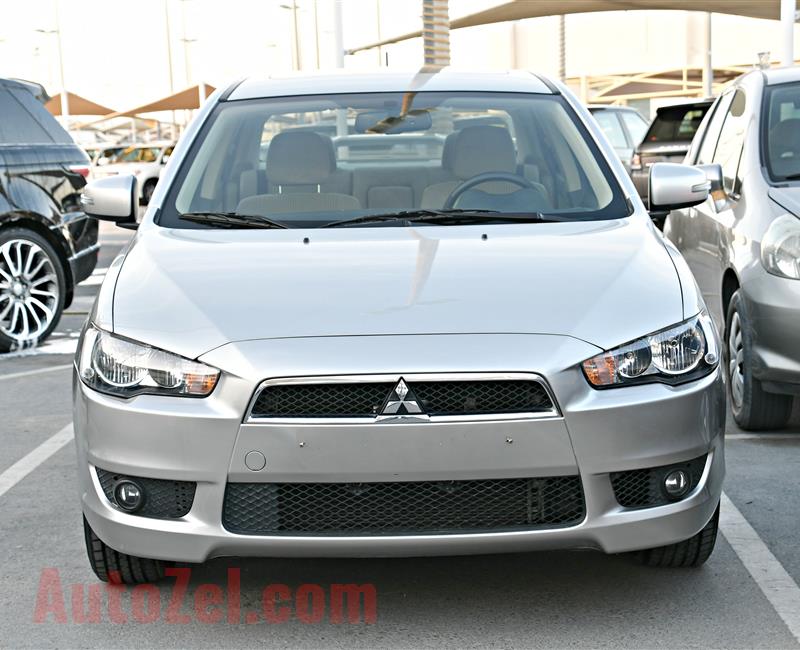 MITSUBISHI LANCER MODEL 2016 - SILVER - 24,000 KM - V4 - GCC 