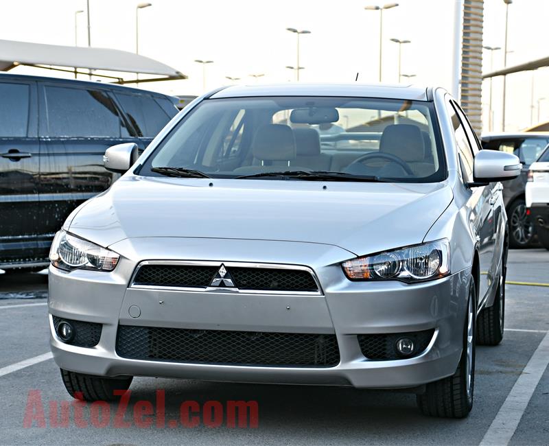 MITSUBISHI LANCER MODEL 2016 - SILVER - 24,000 KM - V4 - GCC 