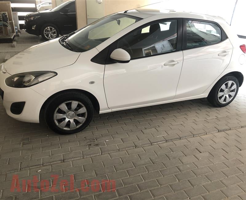 Mazda 2 bought from Gladari ,lady driver with original navigation screen