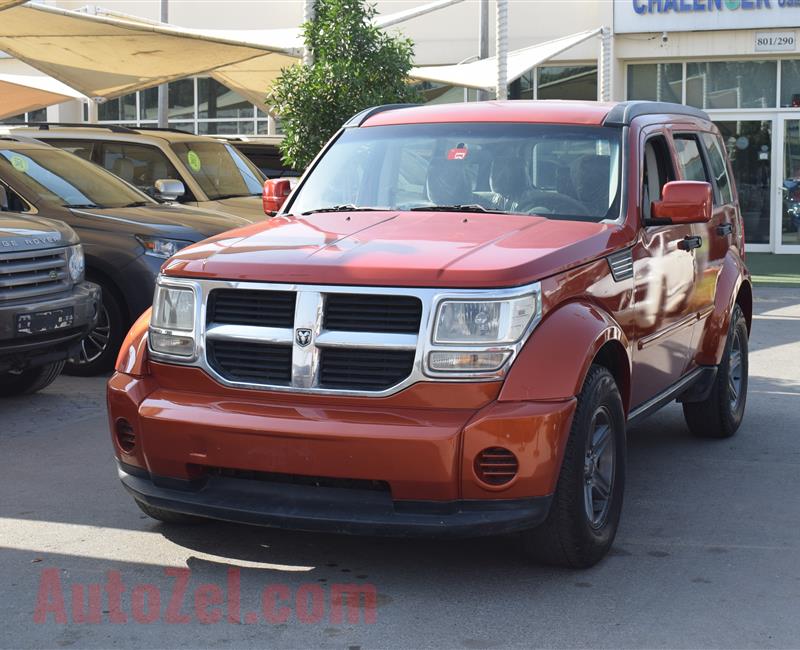 DODGE NITRO 4X4- 2007- ORANGE- 221 000 KM- GCC SPECS- CALL FOR THE PRICE