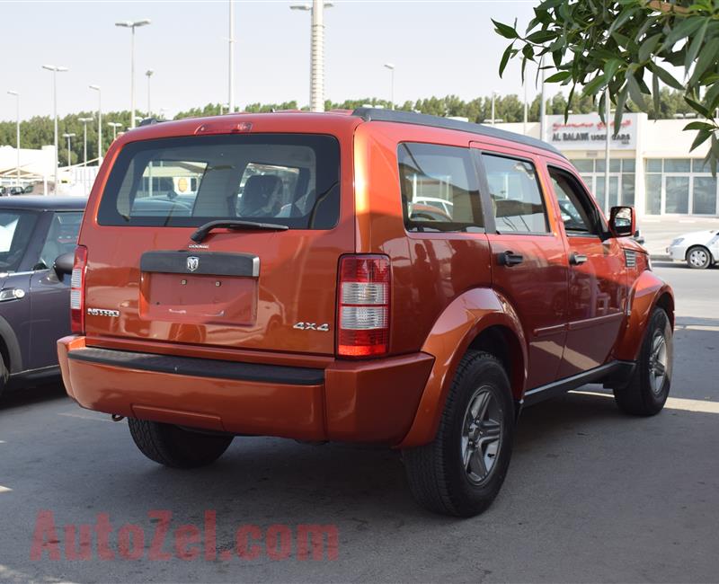 DODGE NITRO 4X4- 2007- ORANGE- 221 000 KM- GCC SPECS- CALL FOR THE PRICE