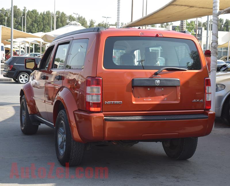 DODGE NITRO 4X4- 2007- ORANGE- 221 000 KM- GCC SPECS- CALL FOR THE PRICE