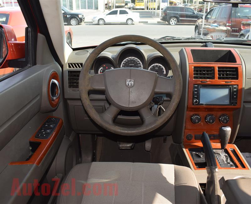 DODGE NITRO 4X4- 2007- ORANGE- 221 000 KM- GCC SPECS- CALL FOR THE PRICE