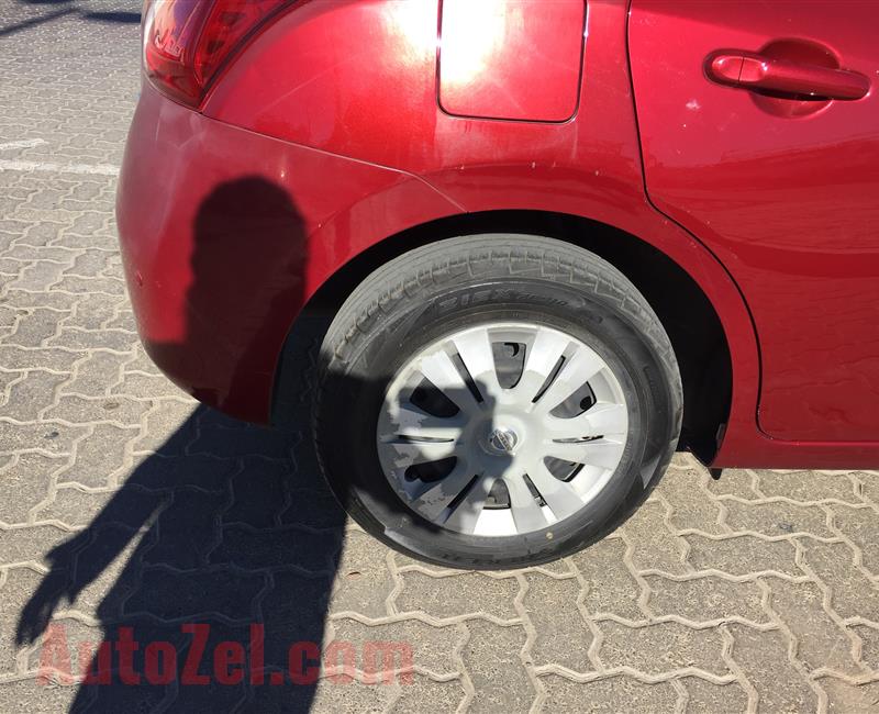 Lady Doctor owned, Red color Nissan Tiida hatchback, 1.6 engine capacity, 45000 km