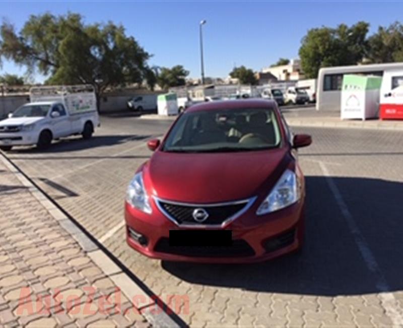 Lady Doctor owned, Red color Nissan Tiida hatchback, 1.6 engine capacity, 45000 km